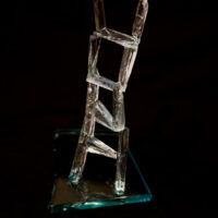 a ladder which is twisting and turning made of broken glass
